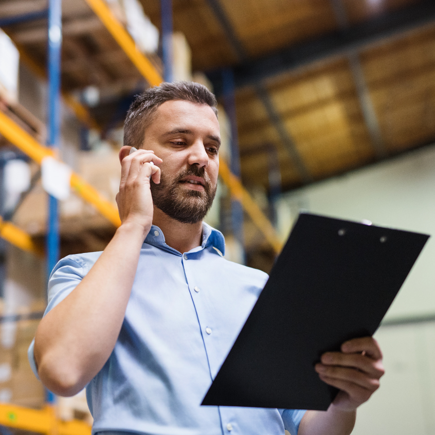 warehouse manager on phone